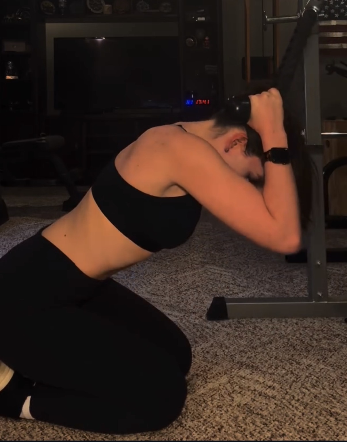 Athlete performing a cable exercise on a home gym